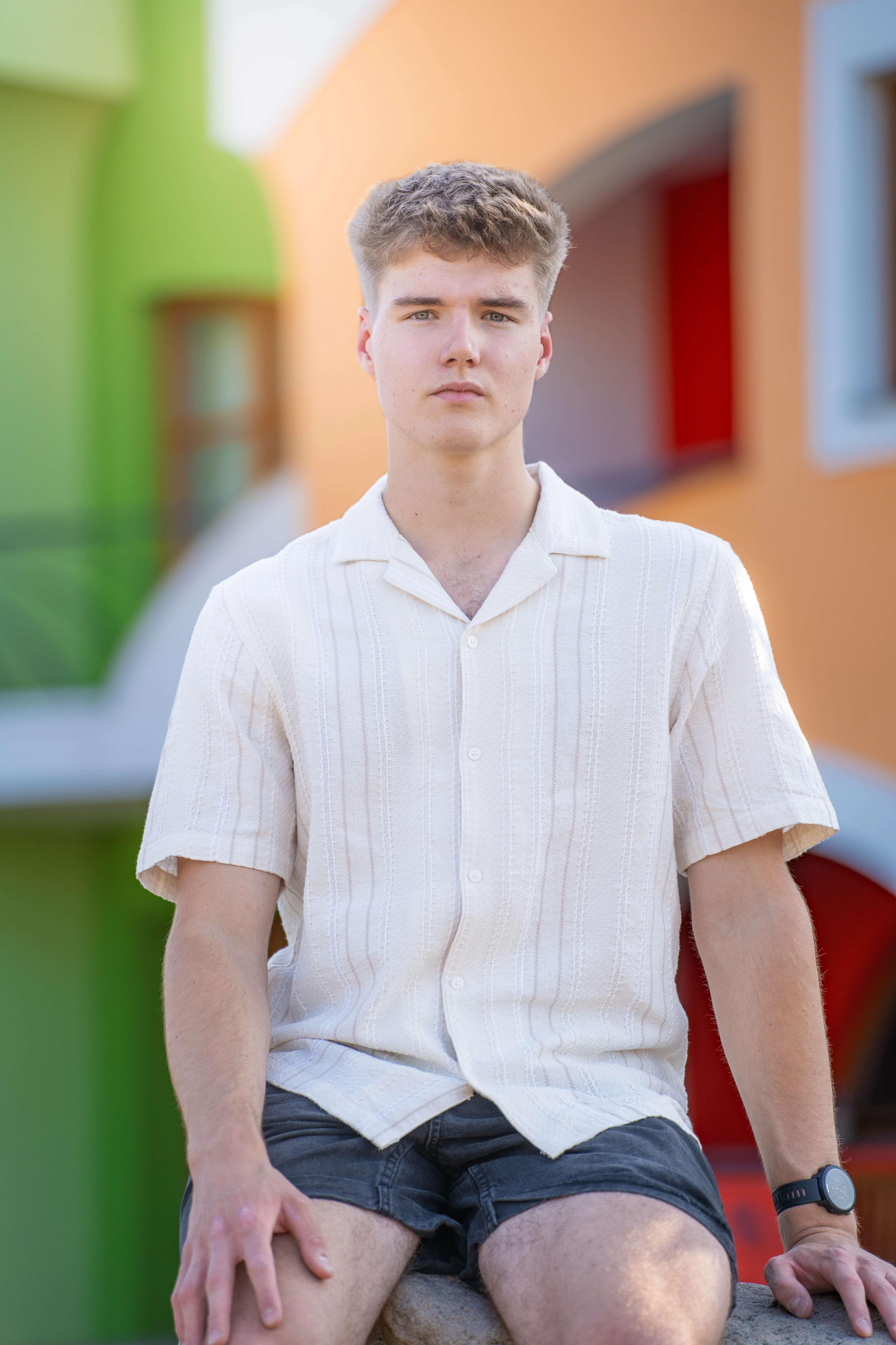 Portrait of Kamil Vítek smiling against a light natural background